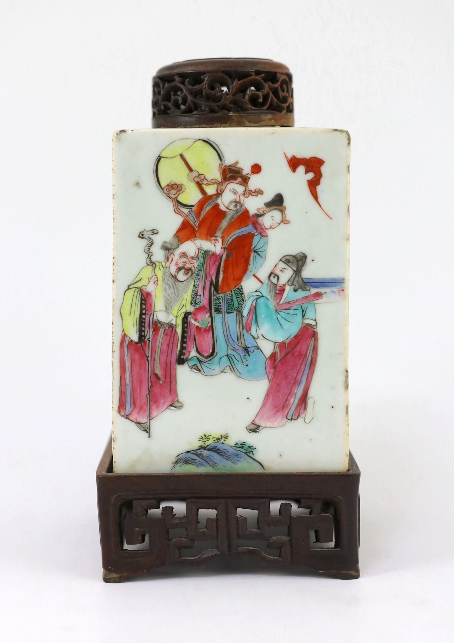A Chinese famille rose square tea caddy, mid 19th century, 13.7cm high excluding wood stand and cover, slight damage